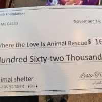 Large check celebrates grant award for new animal shelter